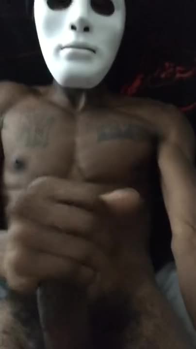 Freaky masked black guy stroking his huge beefy cock solo
