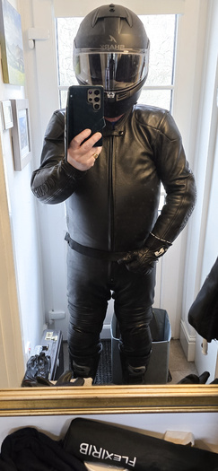 Biker in tight black leather