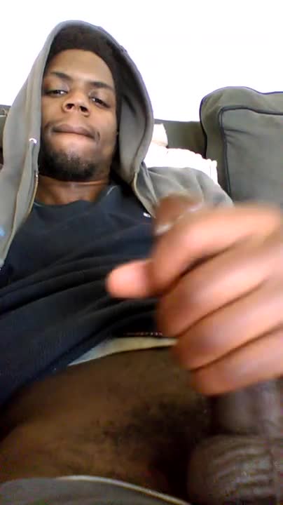 Black thug strokes his huge stick early in the morning