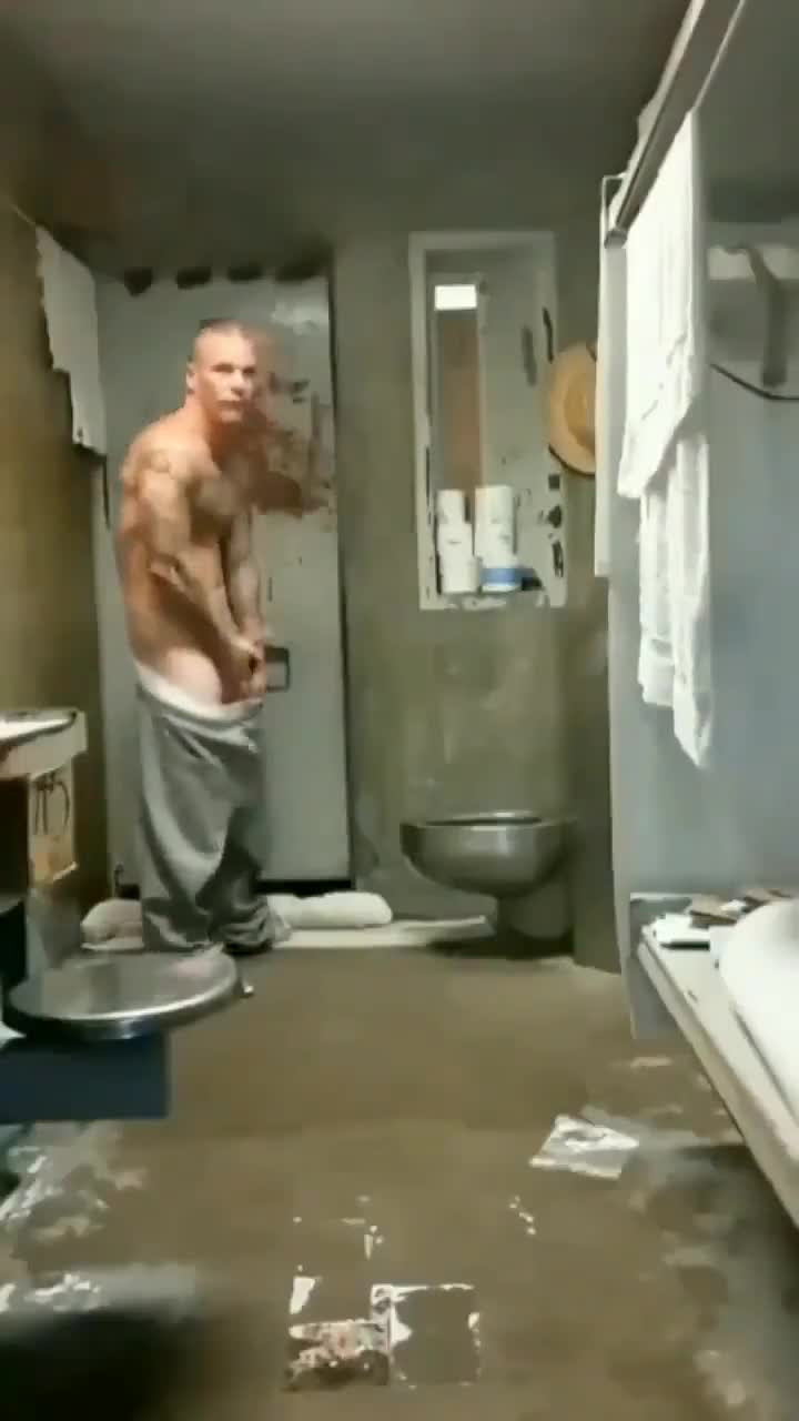 Hung stud from prison still finds a way to show off his big white cock