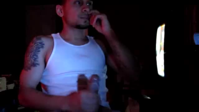 Tattooed dude strokes his cock while watching porn on his computer