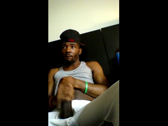 Black thug stroking his beefy meaty huge cock