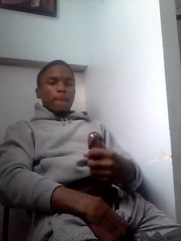 Cute young black dude strokes his mushroom head cock