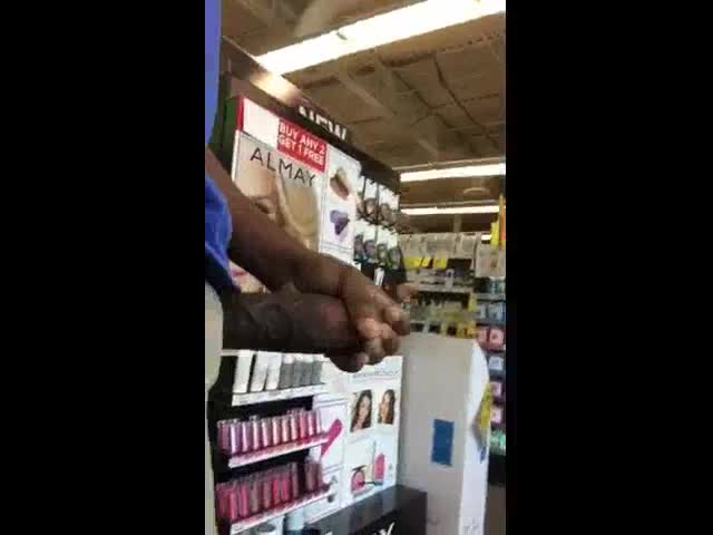 Freaky nigga exhibiting his huge cock in a public place