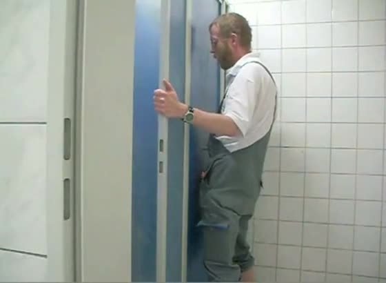 Glory hole in a public toilet