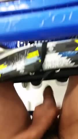 Horny black dude stroking his cock in a supermarket