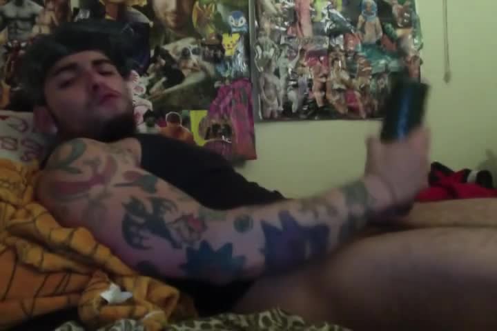 Sexy tattooed dude using his fleshlight to masturbate