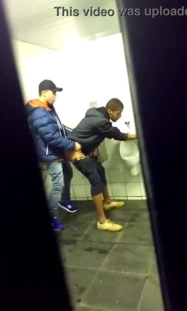 Caught to horny guys fucking in a public toilet