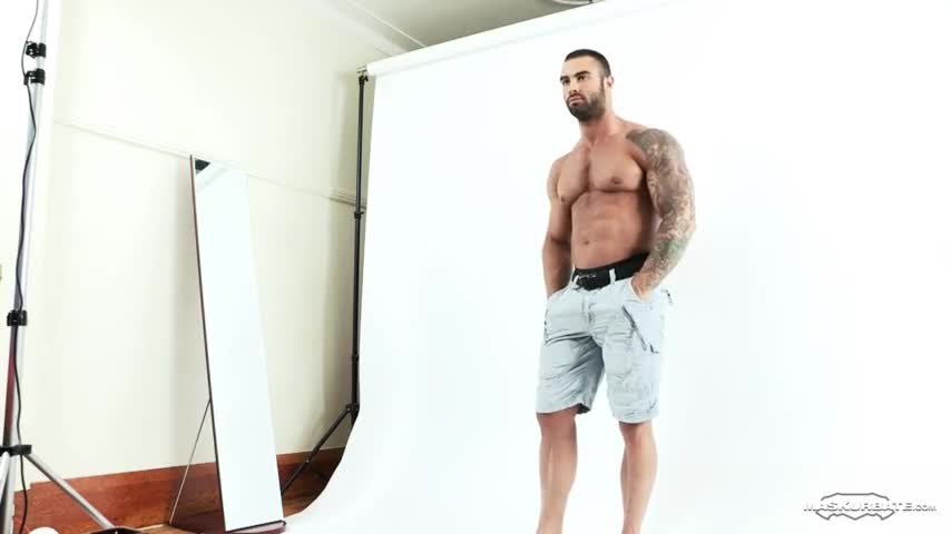 Sexy hunk latino jerking off during a photoshoot