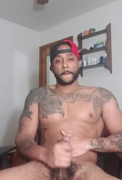 Cute tattooed light skin guy stroking his cock